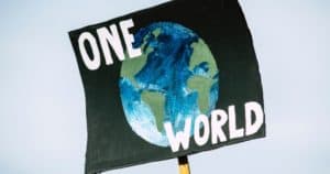 sign that reads ONE WORLD